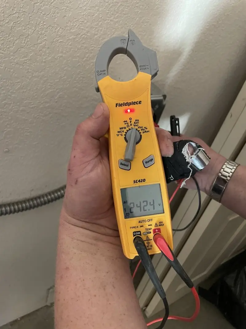 Voltage testing with clamp meter during Electrical Installation Services in Vista
